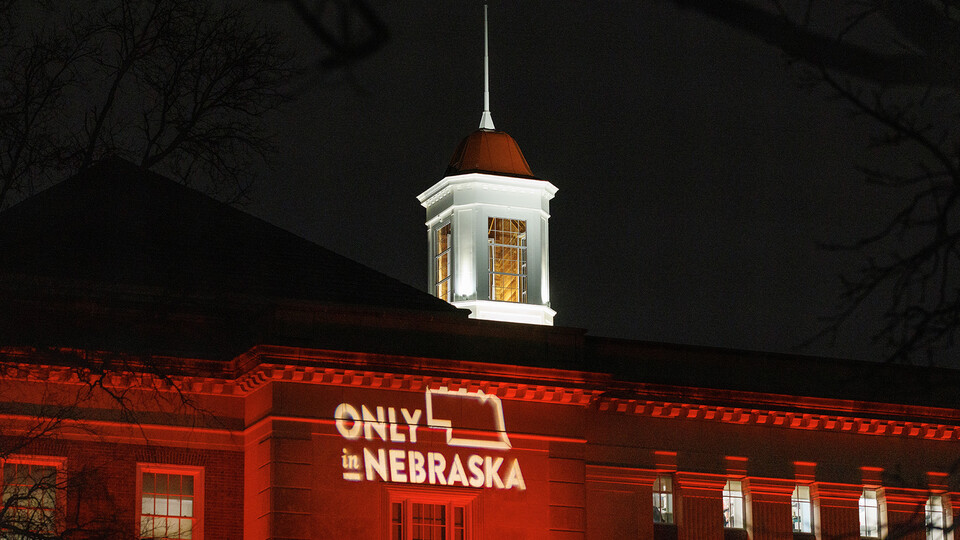 Love Library glows red as part of the university's annual Charter Day celebration. The anniversary observance includes the annual Glow Big Red giving campaign. [Craig Chandler | University Communication]