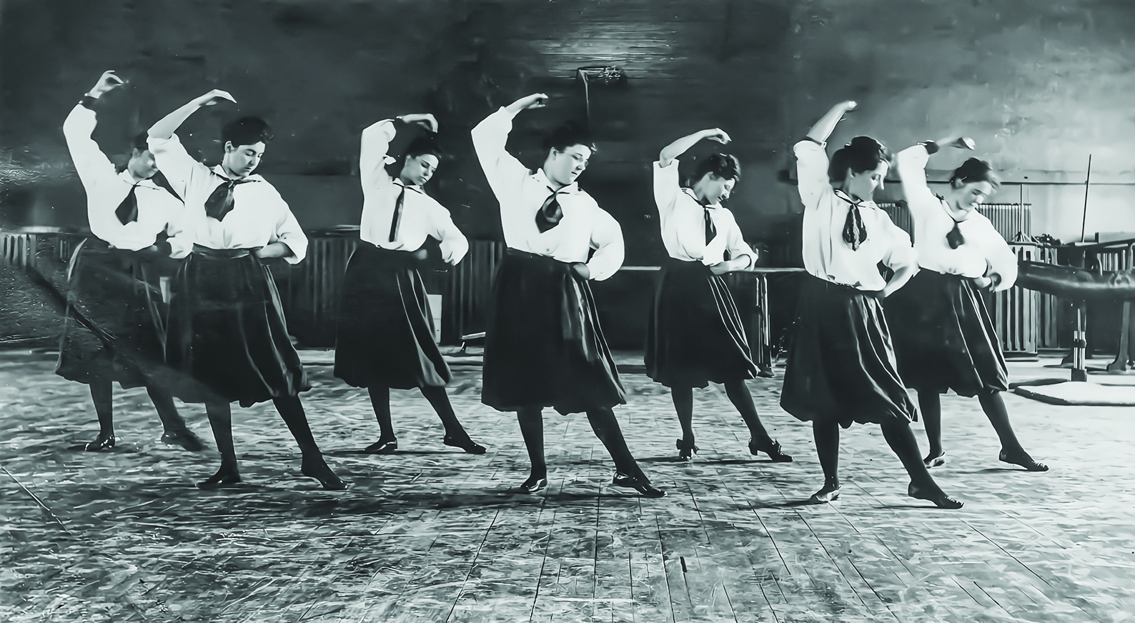 Practicing dance in physical education class about 1900-1904. Photo from Alice Deweese's scrapbook, Archives & Special Collections. 