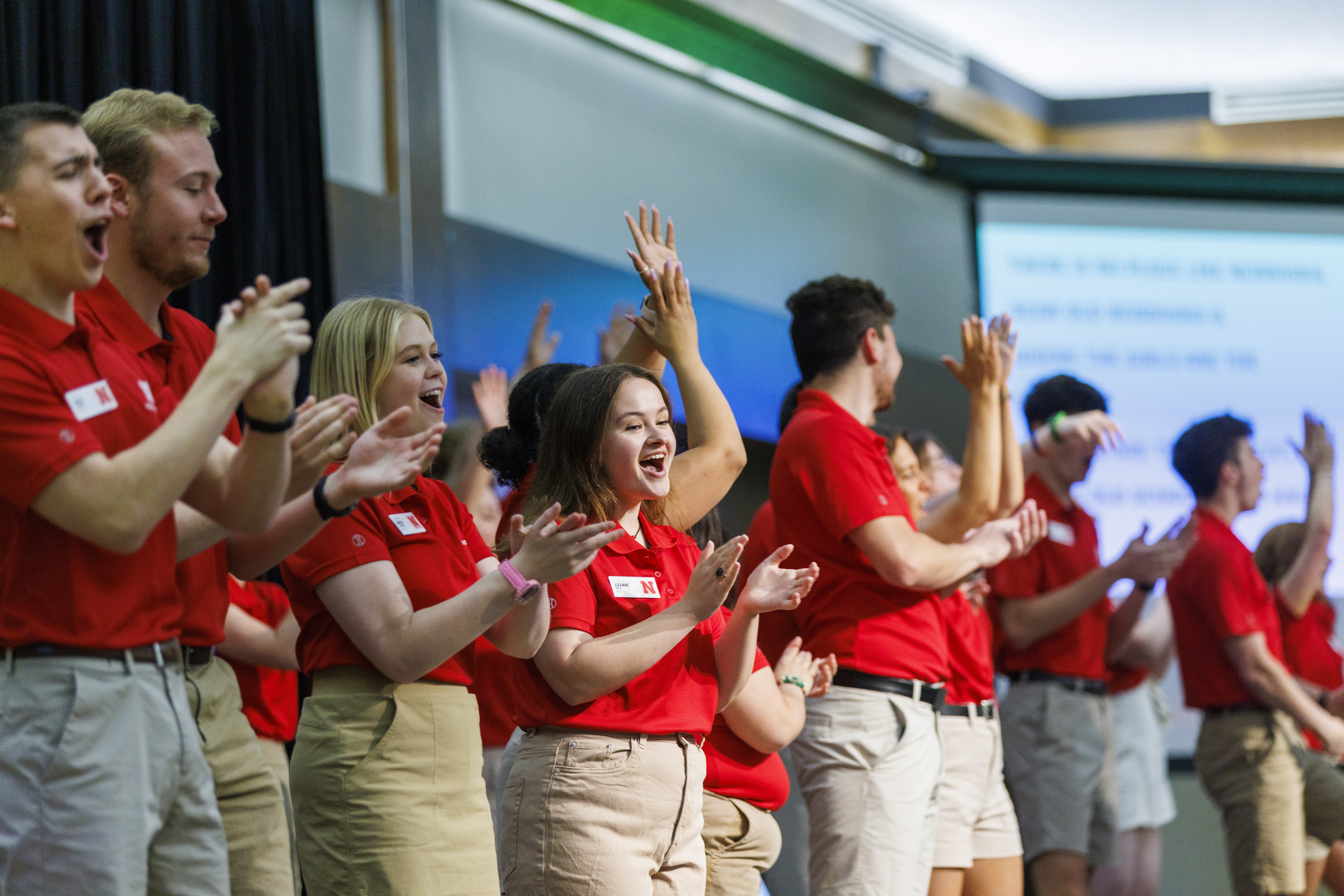 Orientation Leaders leading incoming students in a cheer.