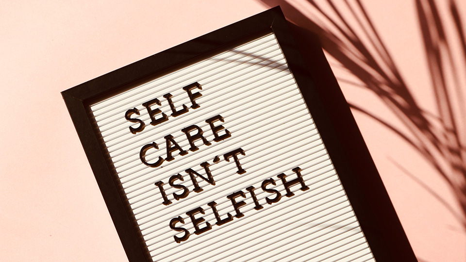 Letter board with "self care isn't selfish"