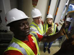 Bruce Dvorak (center), professor of civil and environmental engineering, coaches Yves Cedric Tamwo Noubissi (left), a student in mechanical engineering, and Sussan Moussavi, graduate student in civil engineering, in the use of a Fluke Precision Acoustic I