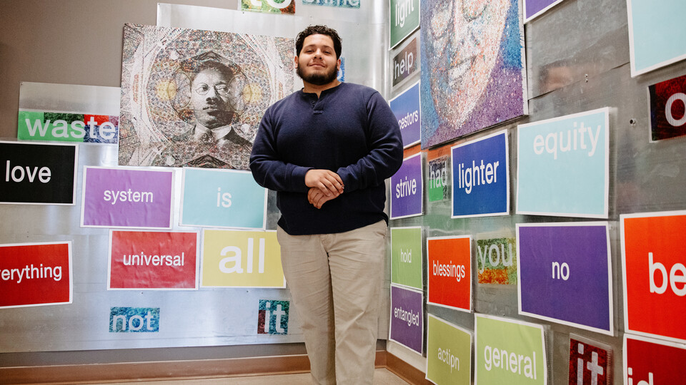 Greg Hermosillo poses in the hallway of the William H. Thompson Scholars Learning Community, located on the 1st floor of the Jackie Gaughan Multicultural Center.
