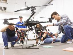 Huskers work on a drone in a College of Engineering lab in 2022. A UNL research team will work to design drones and boats capable of navigating Alaska's difficult terrain.