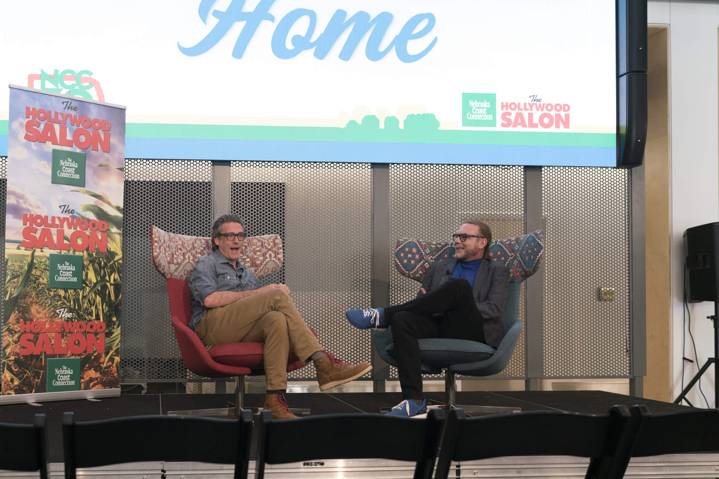 Jon Bokenkamp (left) and Todd Nelson have a conversation during the Nebraska Coast Connection's Hollywood Salon Comes Home event on May 8 at the Johnny Carson Center for Emerging Media Arts. Photo by Laura Cobb.