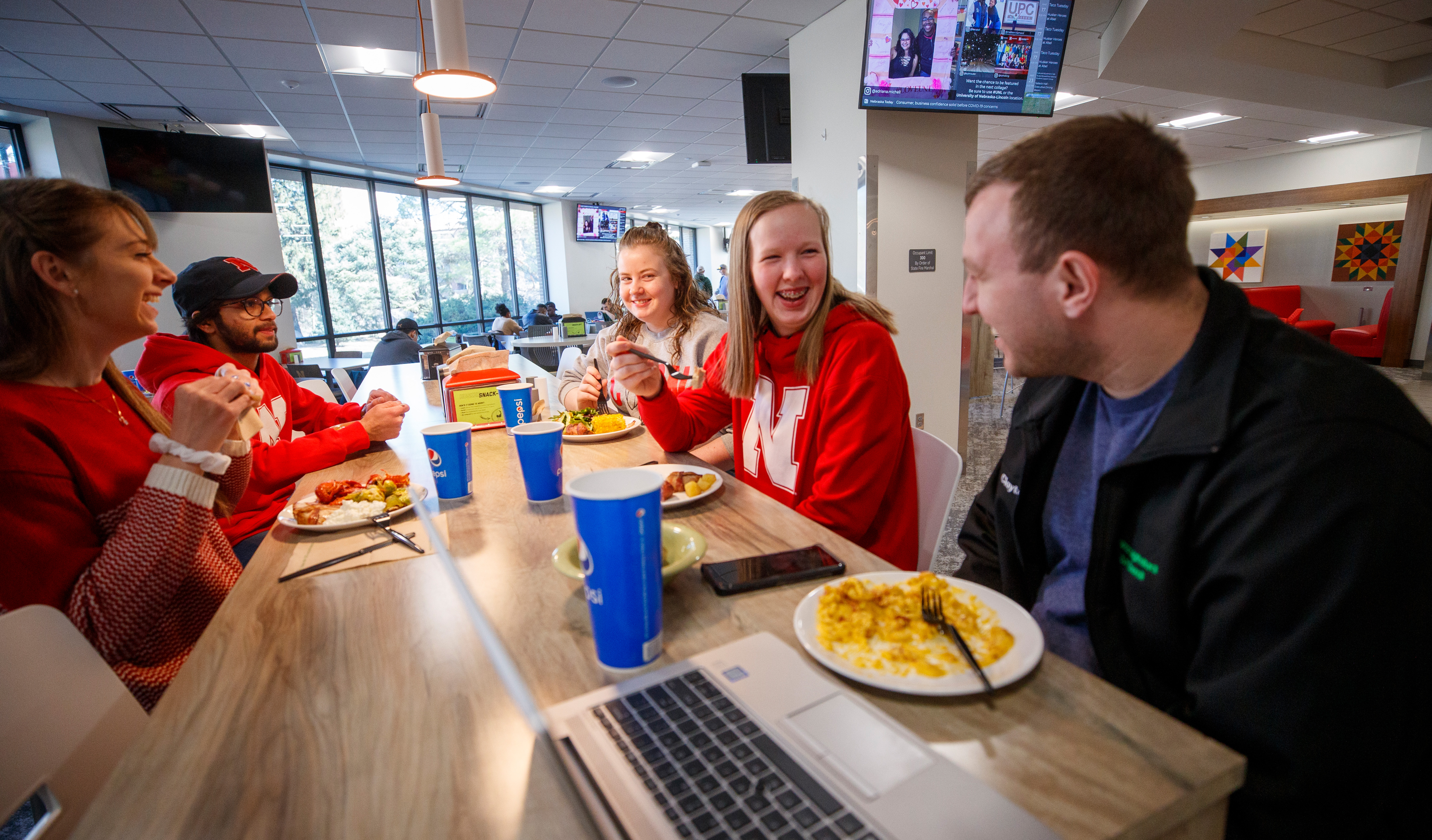 Students enjoy a meal and conversation at the East Campus Dining Center