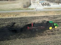 Biochar is applied to 16 acres of farmland in northeast Lincoln with a manure spreader during University of Nebraska–Lincoln research trials in April. 