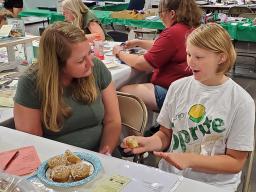 A 4-H'er interview judging a foods & nutrition exhibit at the 2022 Lancaster County Super Fair.