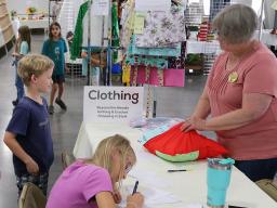4-H'ers checking in clothing exhibits at the 2022 Lancaster County Super Fair