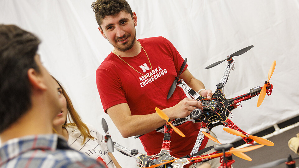 STEM CONNECT scholar Santiago Giraldo discusses unmanned aerial vehicles at the University of Nebraska-Lincoln's NIMBUS (Nebraska Intelligent MoBile Unmanned Systems) Lab in 2022. 