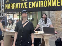 Trystan Nord (right) watches as Assistant Professor of Emerging Media Arts Ash Eliza Smith tries out “Can You See How I See?” in London. Courtesy photo.