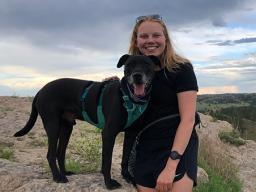 Caily Schwartz, Natural Resources Science with a specialization in Human Dimmensions PhD candidate, and her dog, Finn. 