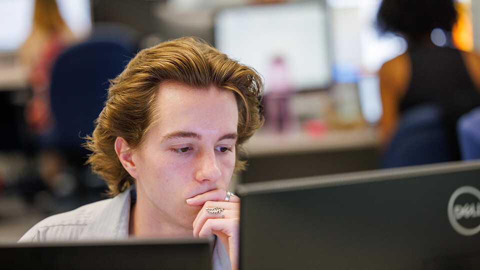 Ethan Dunn, a senior political science major from Omaha, researches a case June 14 as part of the project “Petitioning for Freedom: Habeas Corpus in the American West,” under faculty adviser Katrina Jagodinsky.