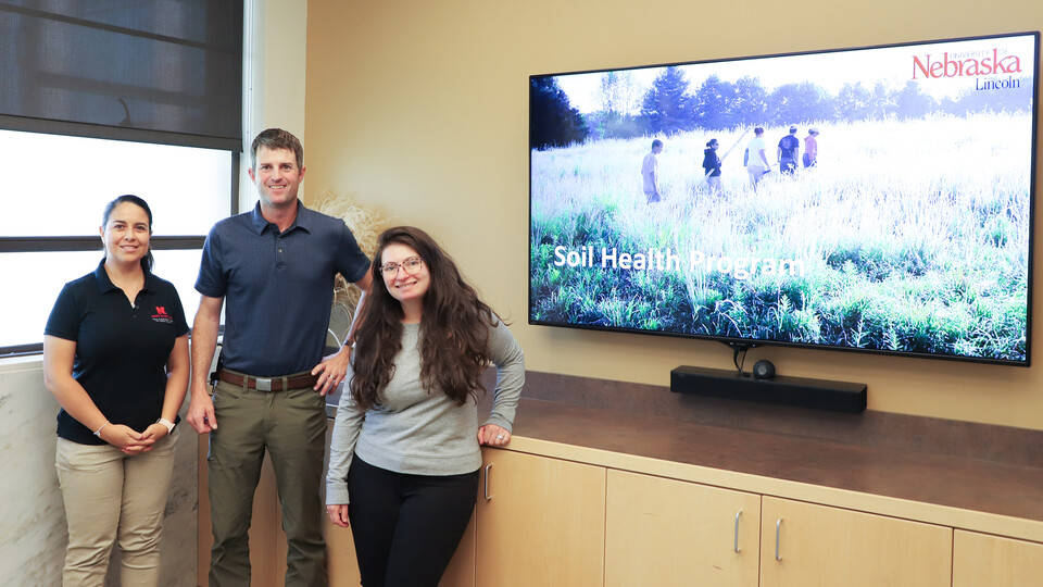 Carolina Córdova (left), Aaron Hird and Ariel Freidenreich met June 23 to begin a new soil health team that brings together university, state and federal soil experts.