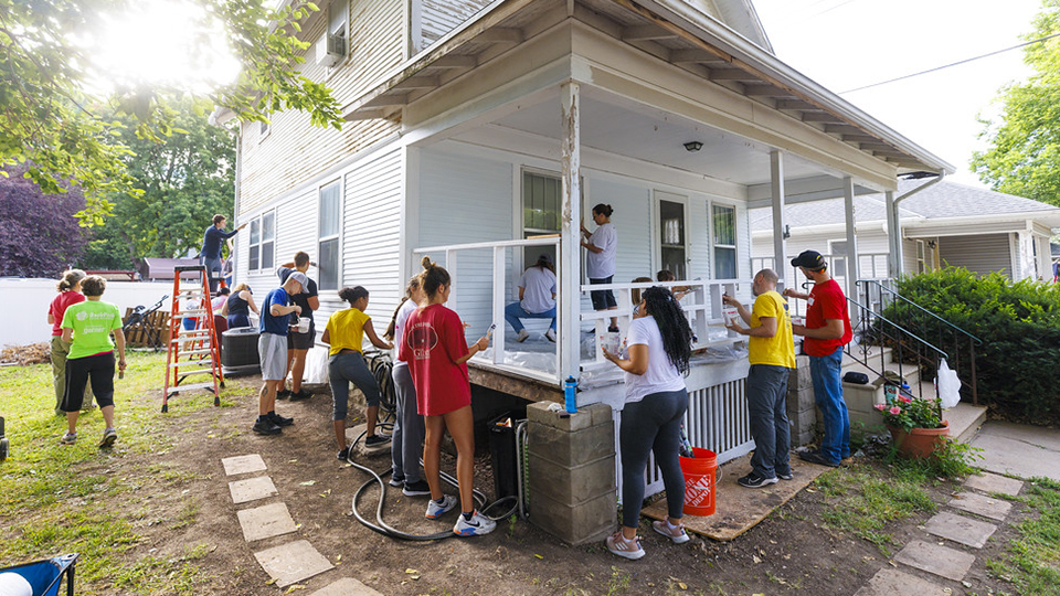 First-year students spent time last August painting homes in Lincoln.