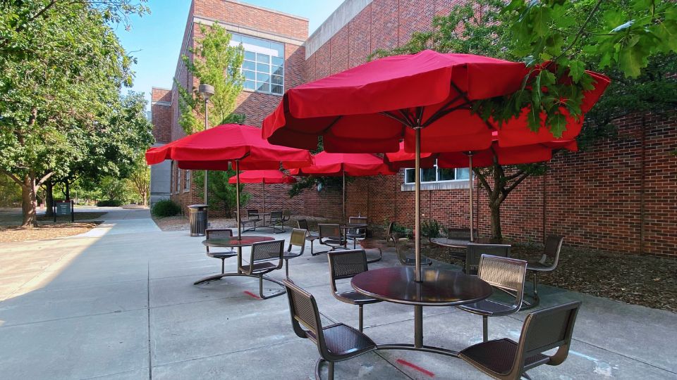 Umbrella-covered outdoor tables are a new addition the west side of the Nebraska Union.