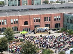 Nebraska Bluegrass Concert attendees enjoy a performance by The Steel Wheels in the NIC Plaza.