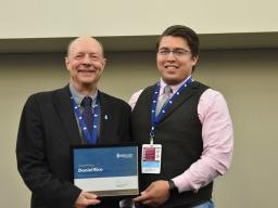 Daniel Rico accepts his first place award at the 2023 Water for Food Global Conference.
