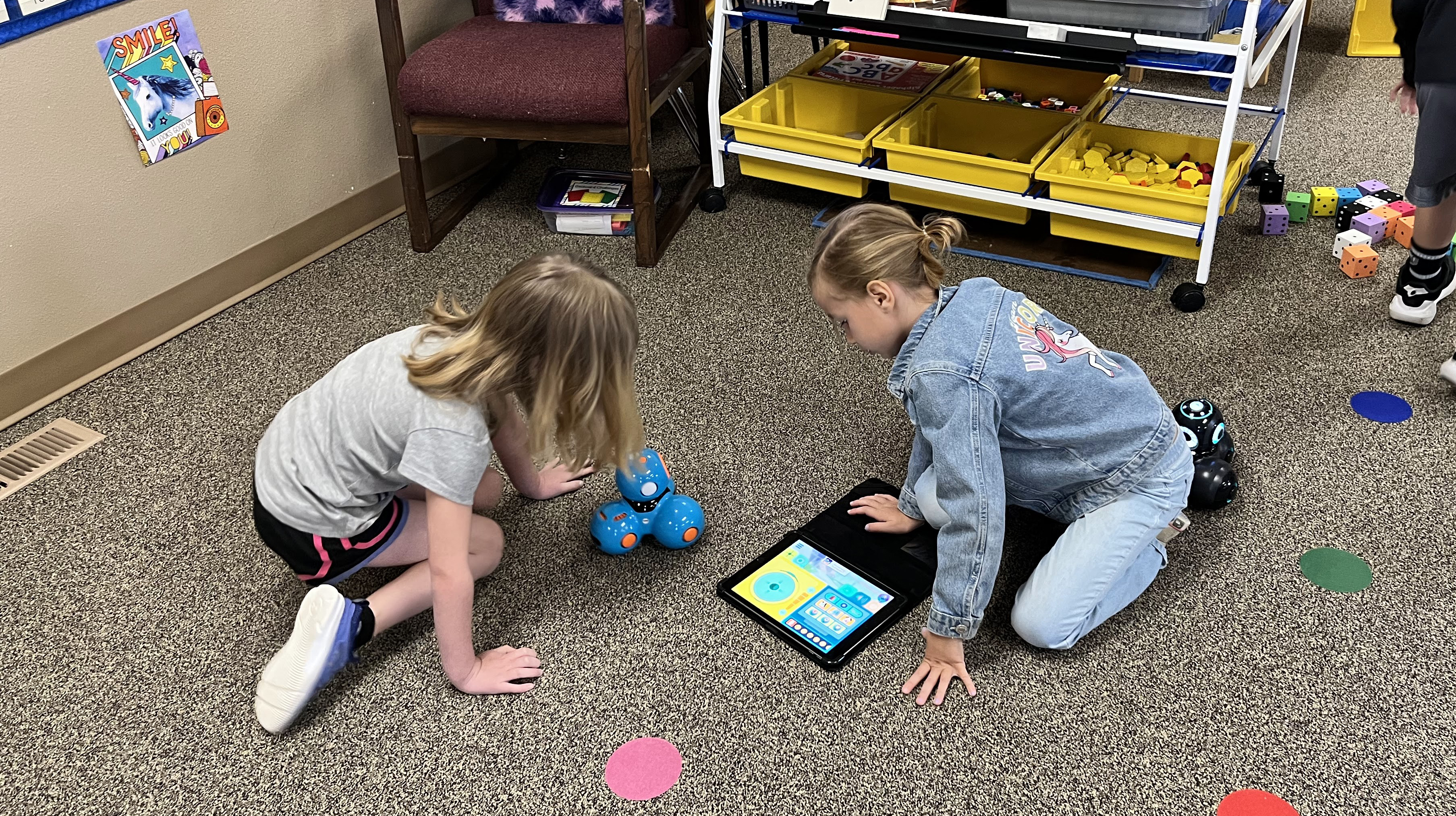 Students in Mitzi Luedtke's class at Humphrey Public School work with their Dash robot in Spring 2023.