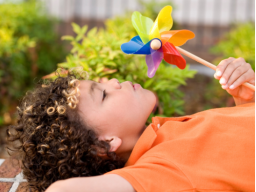 Child Blowing Pinwheelcropped.png