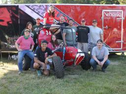 Members of the Baja SAE (Society of Automotive Engineers) design team pose with their completed car. 