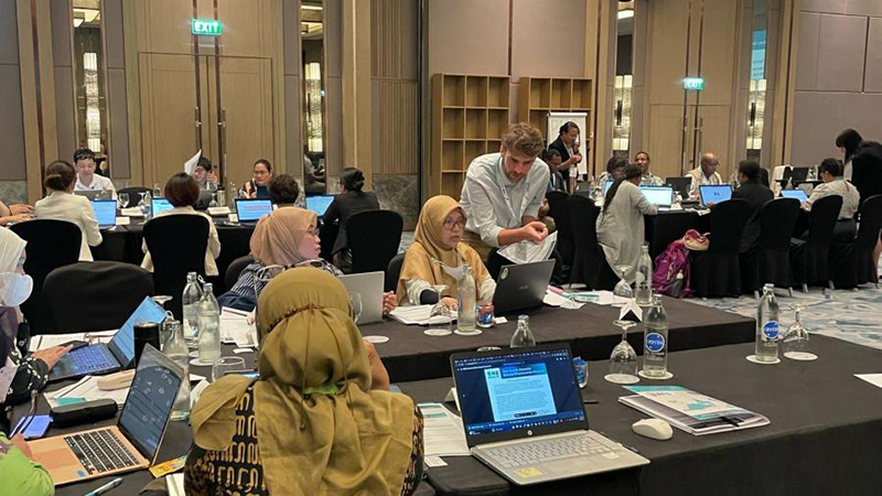 Dominic Cristiano, a research fellow with the Centers for Disease Control and Prevention, takes questions from Indonesian health workers in a One Health Zoonotic Disease Prioritization workshop in Thailand in April 2023