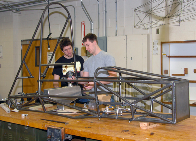 Mechanical engineering majors (from left) Griffin Hovorka and Anthony Hansen discuss the fuel tank positioning in Husker Motorsports' Formula SAE entry. UNL will host a national Formula SAE competition, June 20-23. 