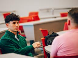 A student connects with a guest speaker during an entrepreneurship course