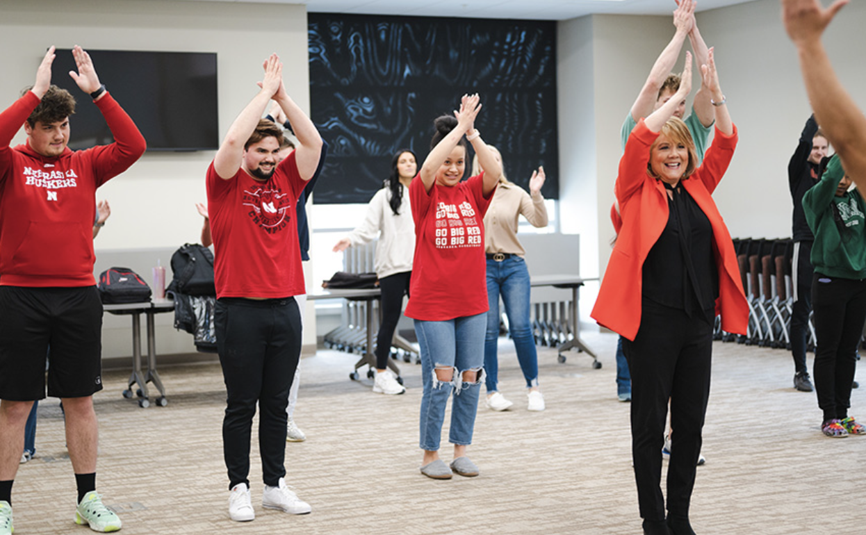 Students participate in an exercise along with their Emmy Award-winning professor, Julie Uribe