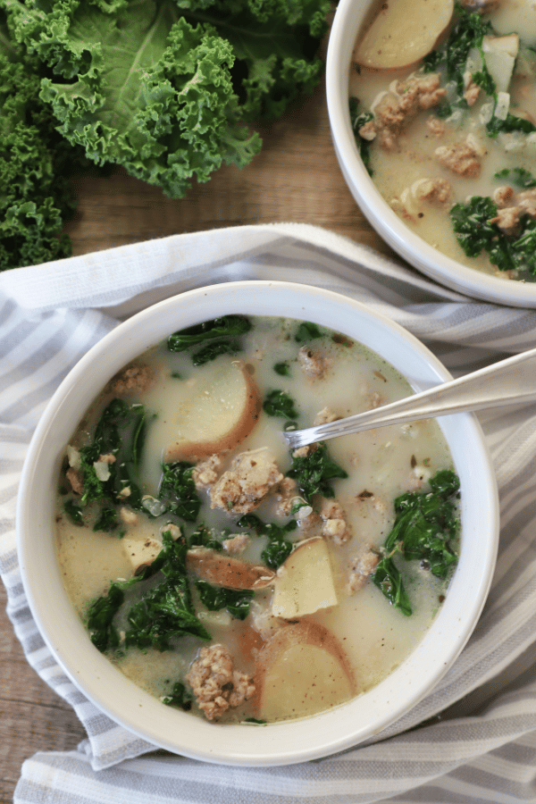 soup with potatoes and kale leaves