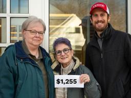 Donations Abound.   Linda Kern, Family Care Coordinator at Clinton (center), and  Dee Ebbeka (l) & Andy Little(r), from SNR.  Photo by Iris McFarlin.