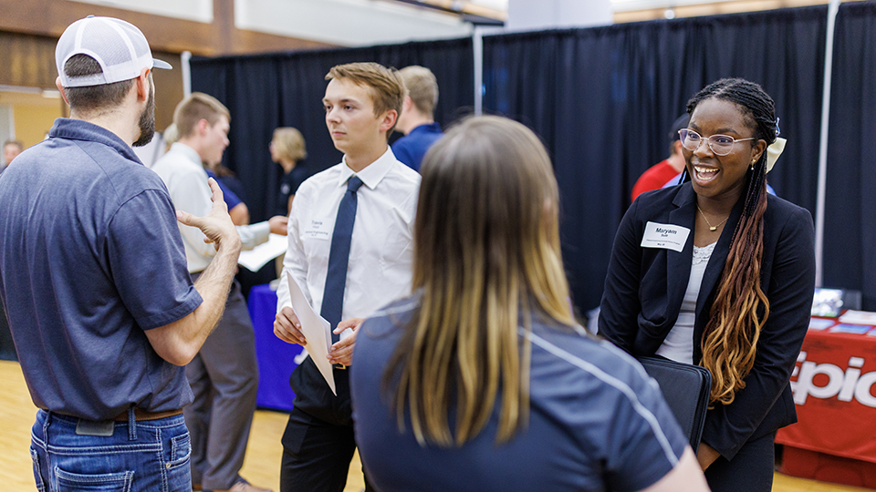 Maryam Sule talks with a recruiter at the Career Fair in the Nebraska Union. September 20, 2023. [photo by Craig Chandler | University Communication and Marketing]