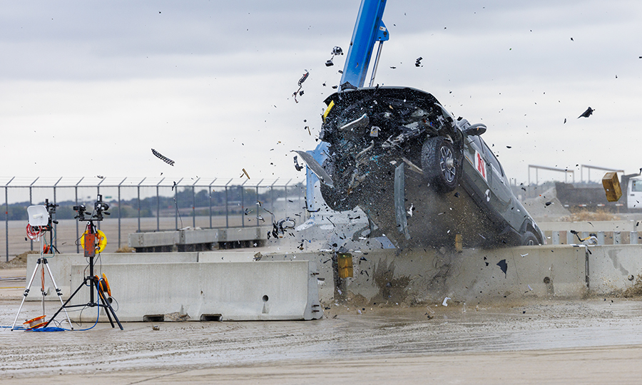 An electric pickup crashes into a concrete barrier during a Midwest Roadside Safety Facility crash test in October 2023. 