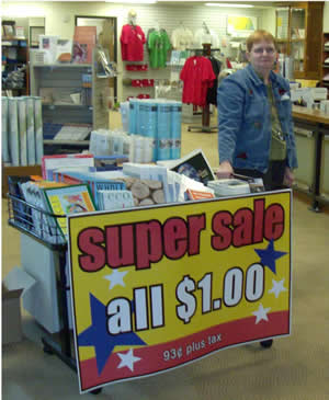 Elaine Connelly is standing by to help shoppers at the Nebraska Maps & More Store.