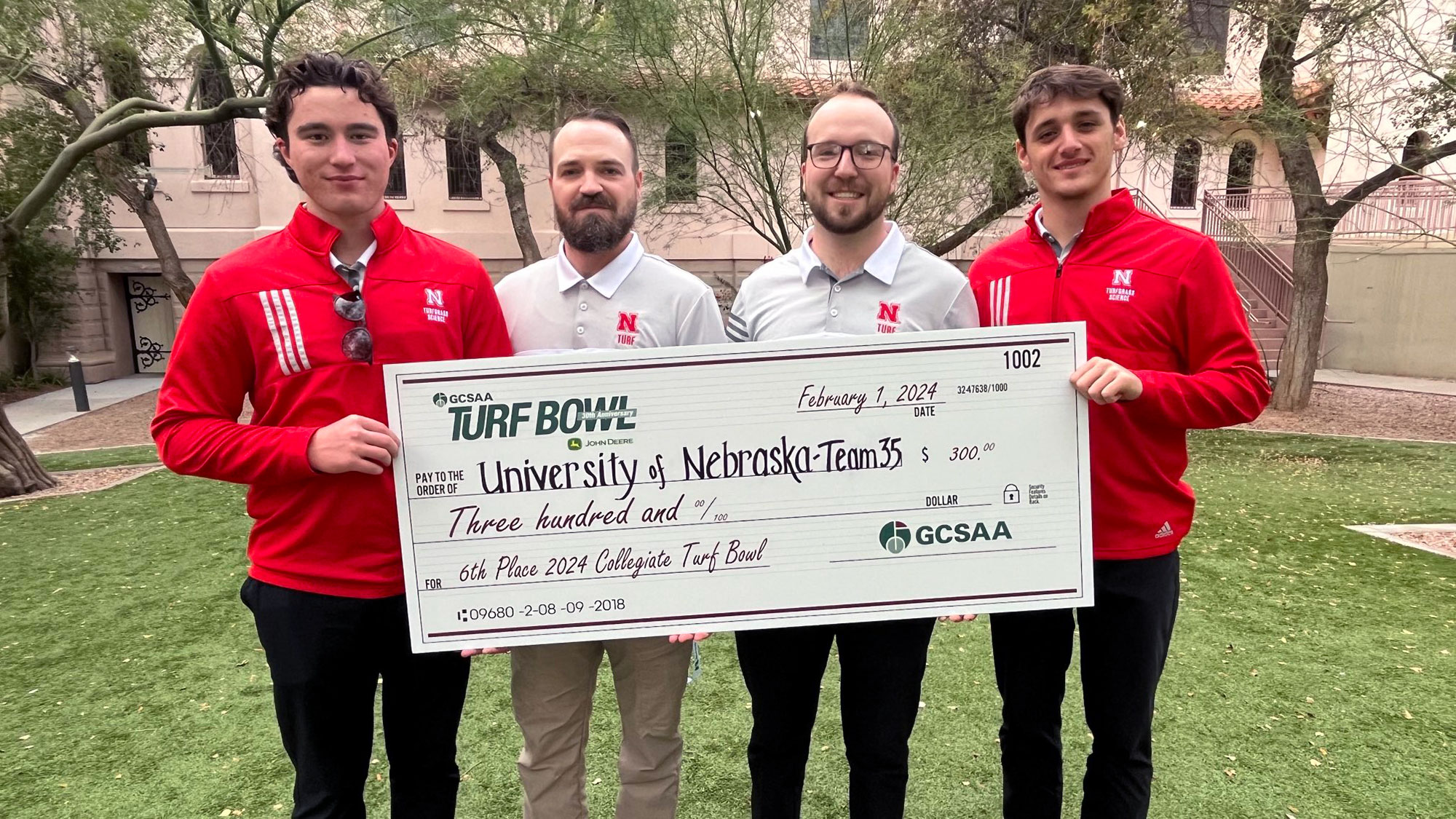 Scout Allen (from left), Alex Uram, John Tines and Matt Boyd hold the winnings from the their 6th place win at the 2024 GCSAA Annual Collegiate Turf Bowl Jan. 31 in Phoenix. 