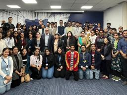 Top: Andy Belser and Hank Stratton with students and faculty at the American Center in New Delhi; Bottom: Megan Elliott with Ankith Menon, head of talent acquisition at Infosys. 