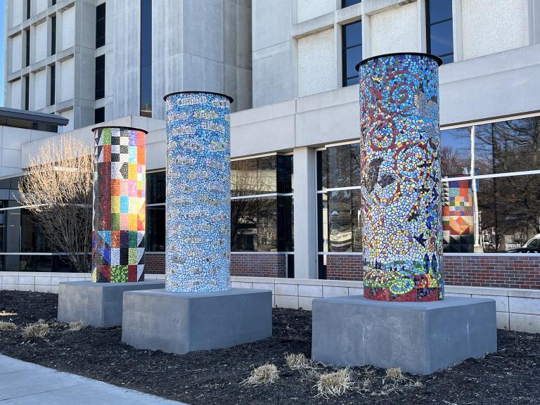 Three tile pillars at the entrance to Bryan West