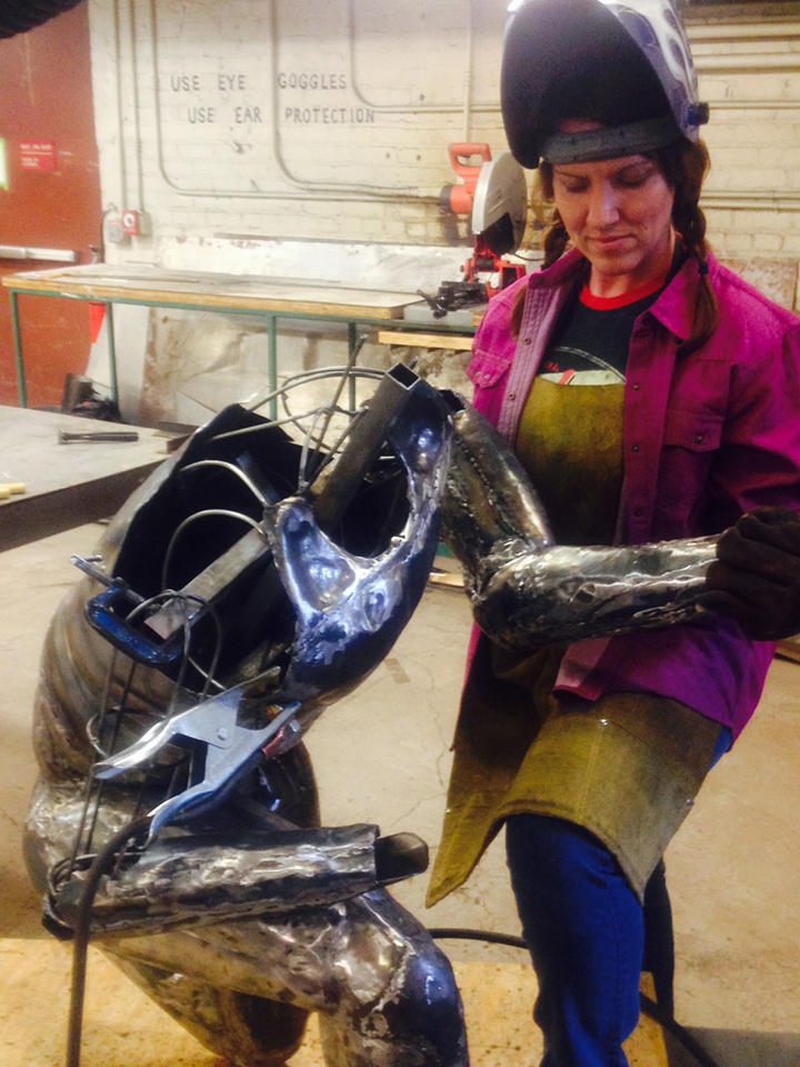 Sculpture student Kelly Wold working on her Elgas Project.