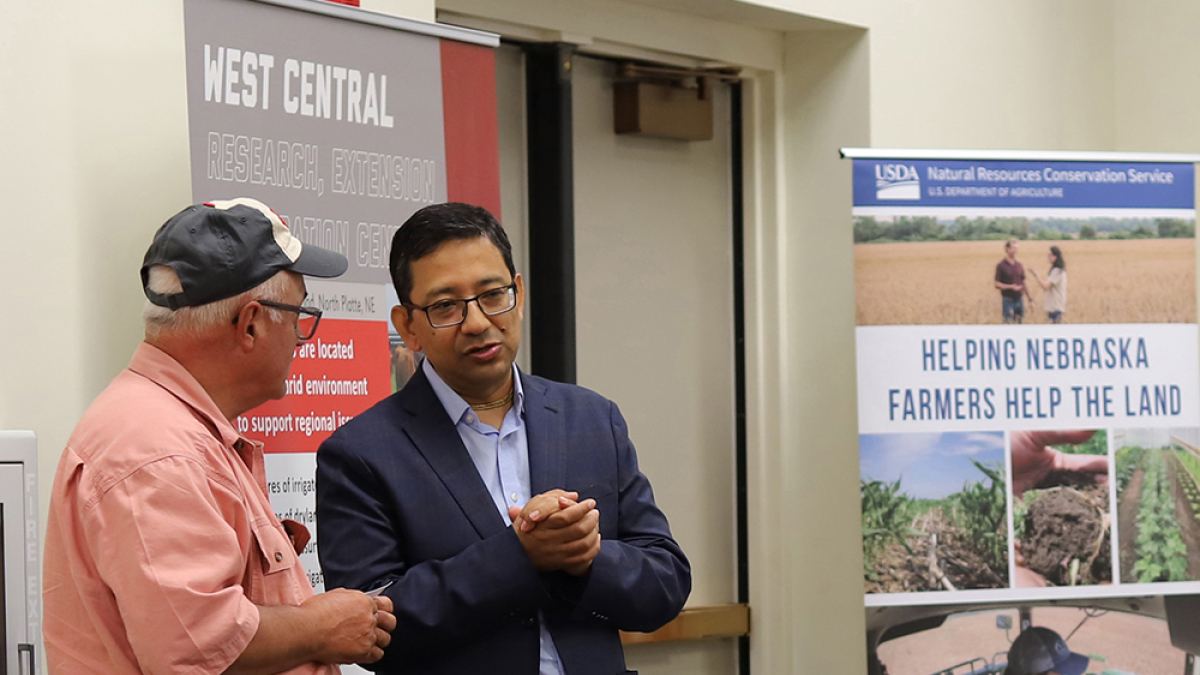 Bijesh Maharjan, Nebraska Extension soil nutrient and management specialist (right), speaks to an attendee at the second Soil Health School at the West Central Research Extension and Education Center in North Platte. Photo by Nicole Heldt
