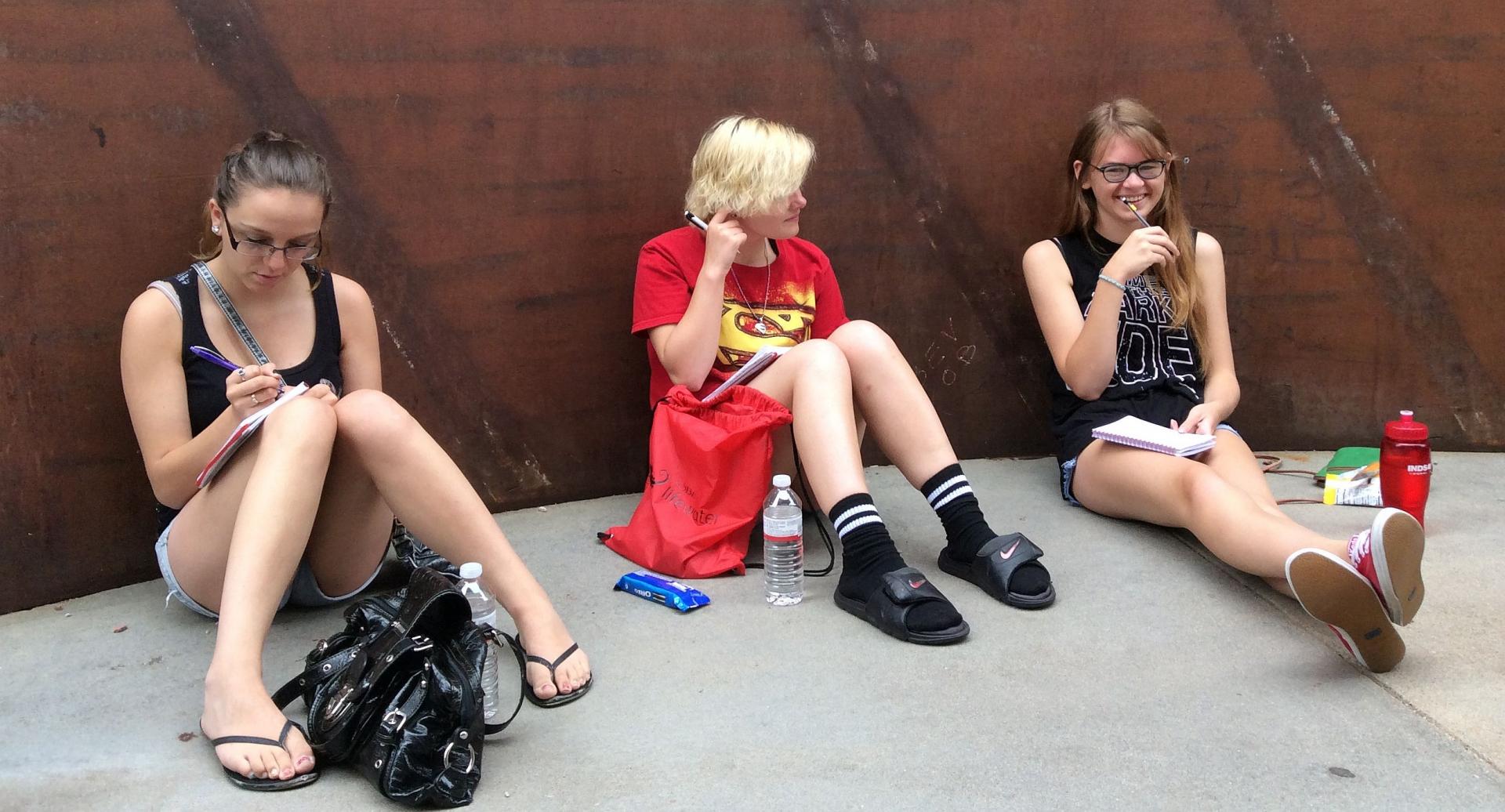 Campers write during a writing marathon on campus