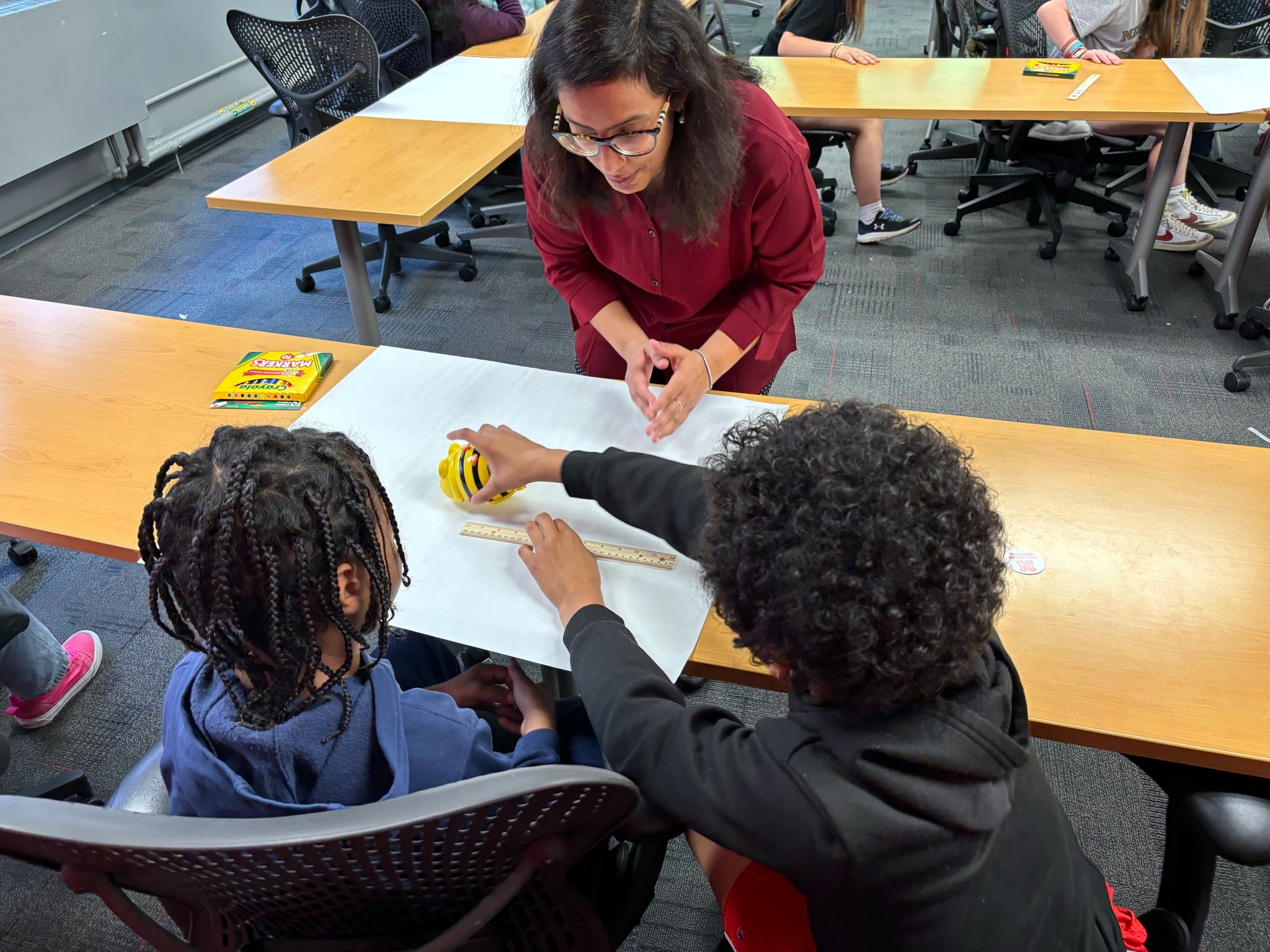 Deepika Menon shares a robotics activity with Edison Elementary School fifth graders in Omaha, Neb.