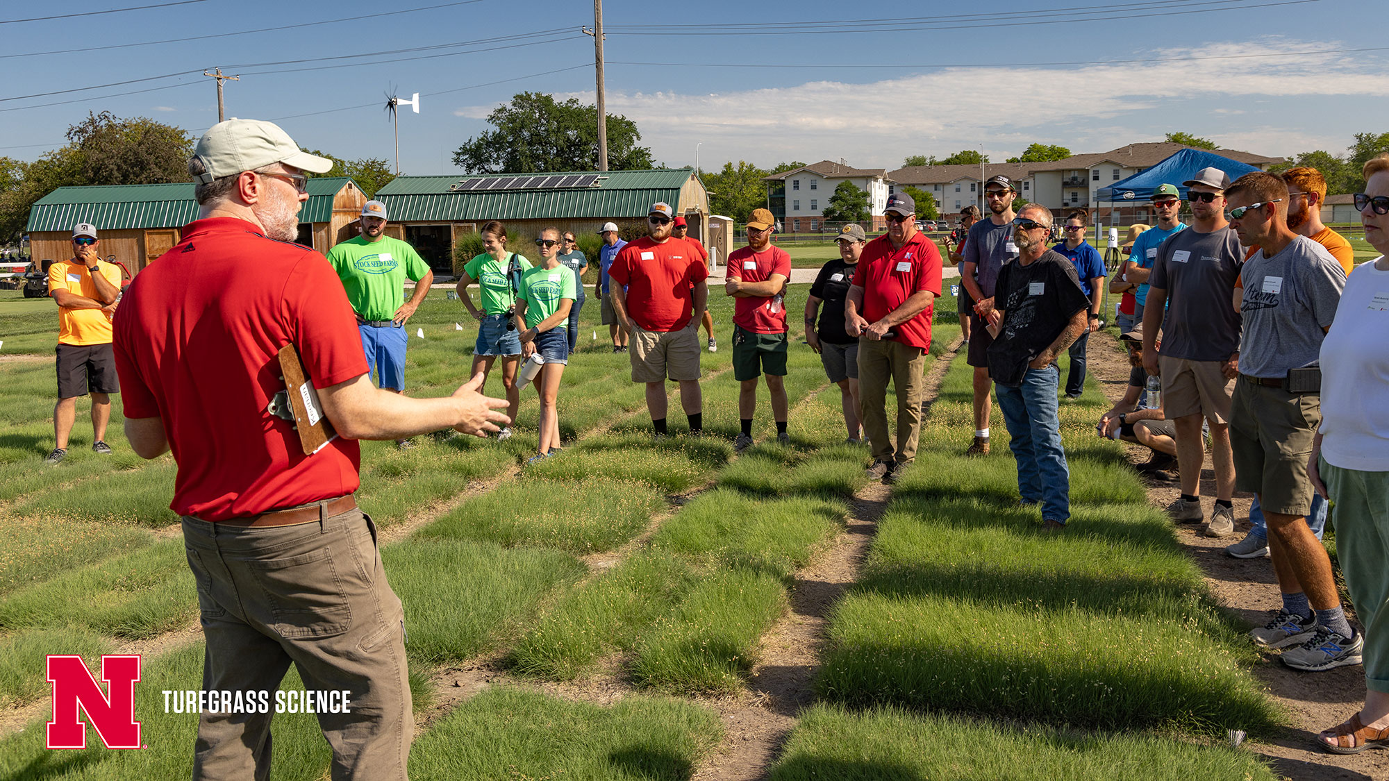 Keenan Amundsen speaks to field day attendees at the 2023 Nebraska Turfgrass Field Day on East Campus. | Luqi Li