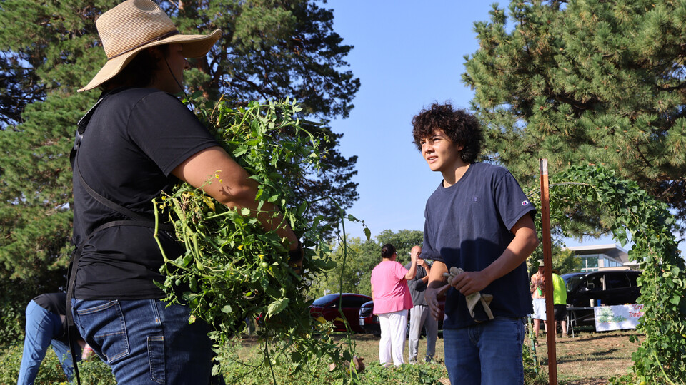 Timothy Thielen (left) talks with a member of the Turtle Island Indigenous Youth Growers.