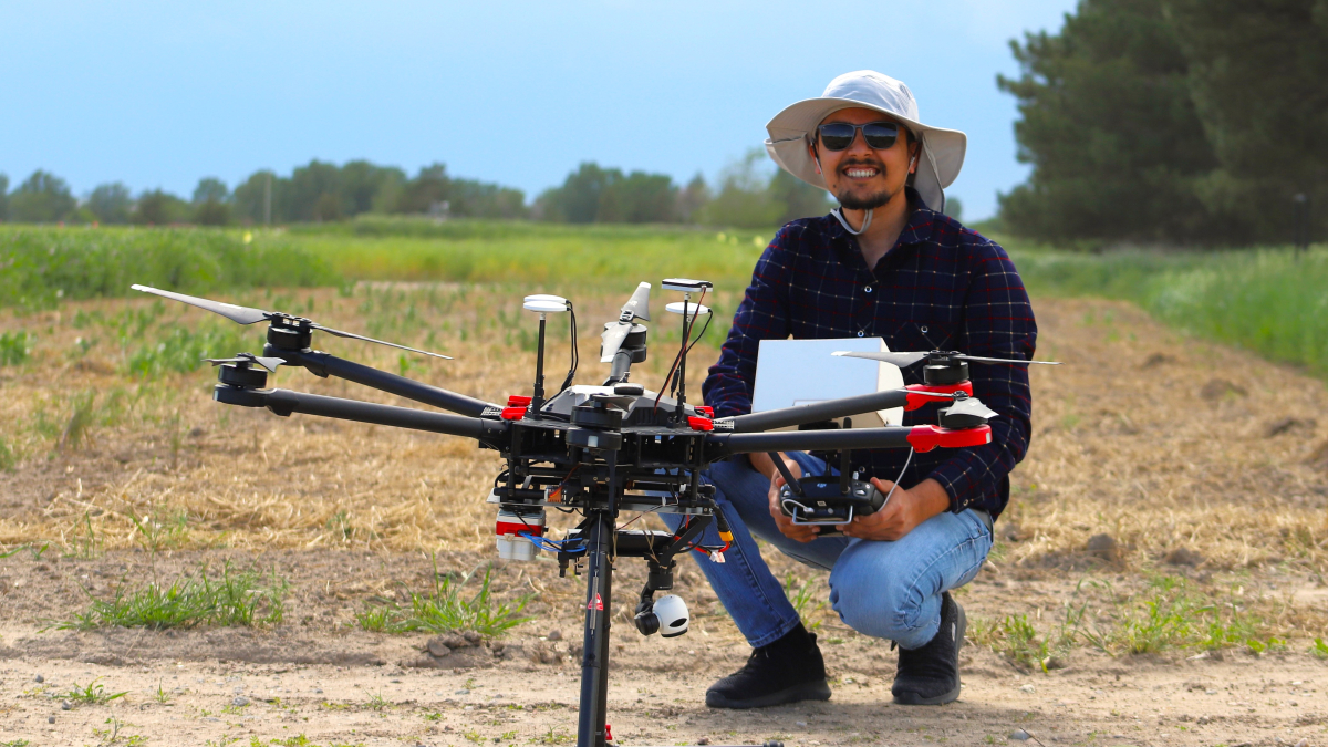 Deepak Ghimire, a Ph.D. candidate at the University of Nebraska-Lincoln Department of Agronomy and Horticulture, holds a drone he uses to take images of crop research plots. | Photo by Nicole Heldt