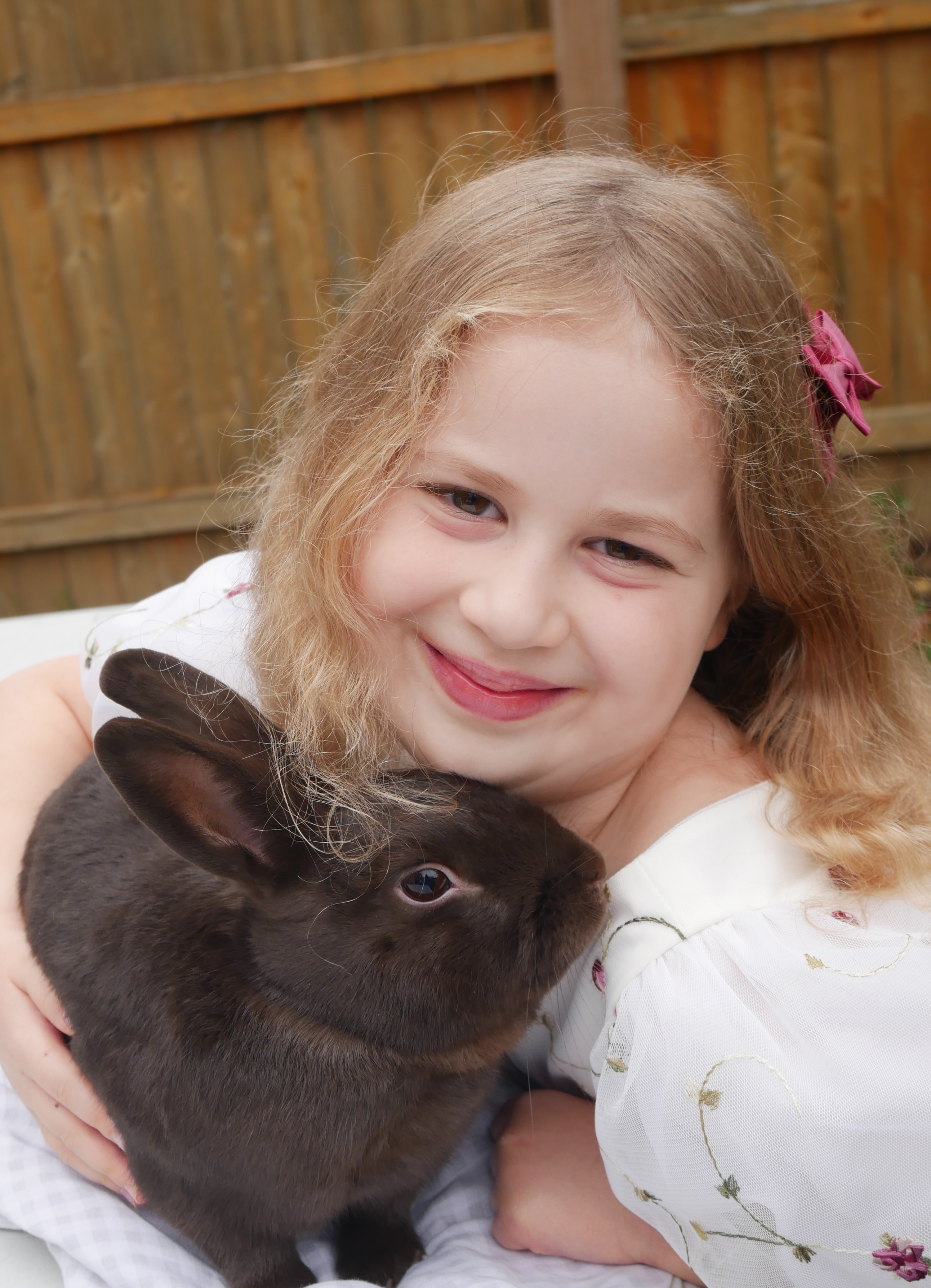 Jocelyn Schmoll's photo of her sister snuggling a rabbit earned Grand Champion in senior photography