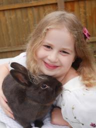Jocelyn Schmoll's photo of her sister snuggling a rabbit earned Grand Champion in senior photography