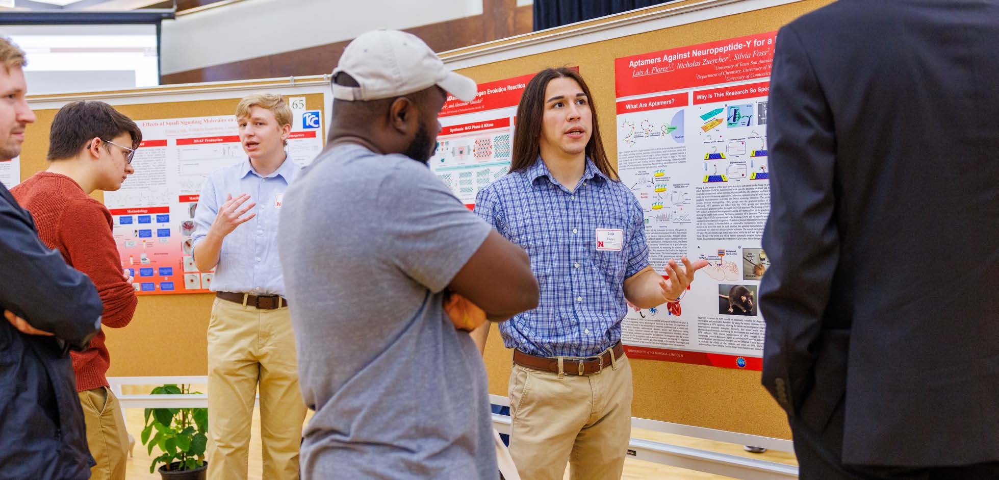 Summer Research Program scholar, Luis Flores, presents their research to the campus community.   Craig Chandler / University Communication and Marketing