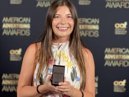 Ava Schicke with her National American Advertising Award for her capstone project, “Scrolling is the New Smoking.” Courtesy photo.