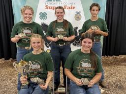 Livestock Elite Showmanship — (front L–R) Josie Johnson, Lexi McCaffree (back L–R) Olivia Vanderford, Emberlin Johnson, Ezra Kubicek