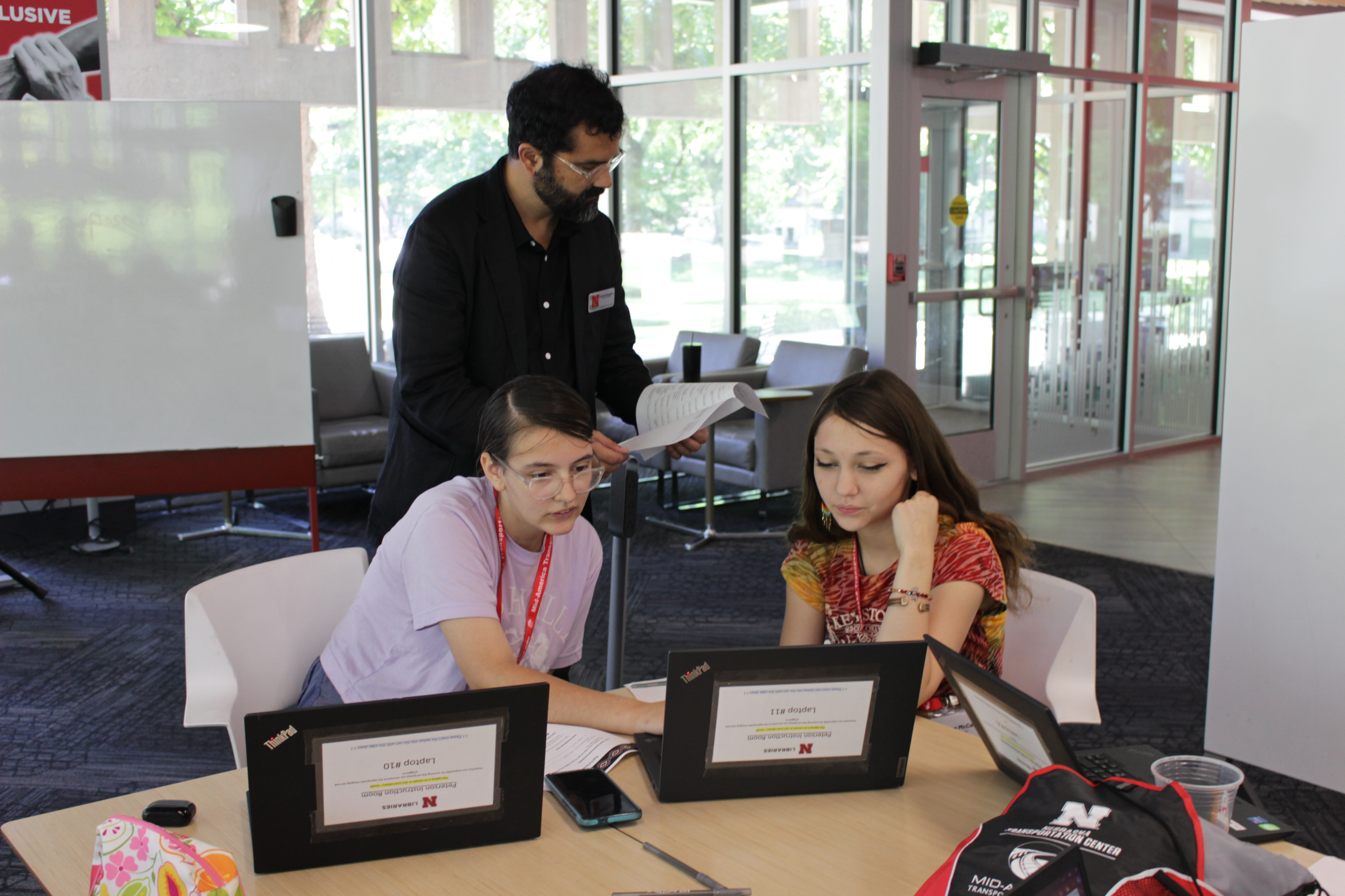 Bruguier works with two of the Sovereign Native Youth. 