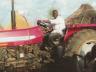 Local Humanitarian Younis Andindi with the tractor he provided to Sudan's Nuba Mountain community to help feed dozens of villages.